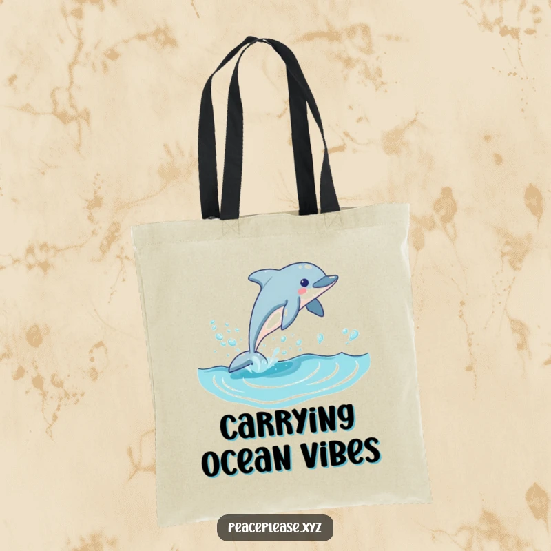 Funny dolphin tote bag illustrated with a playful dolphin leaping out of a blue wave, leaving a shiny trail of bubbles behind.